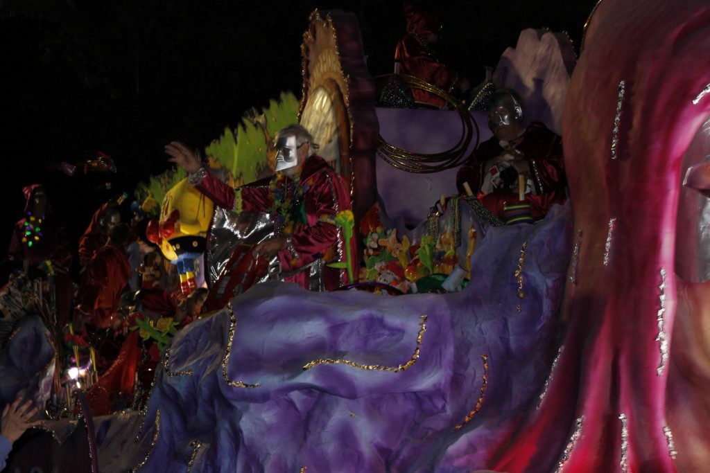 Tossing throws in a Mardi Gras Parade