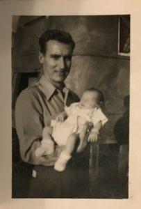 Long lost relatives - as a baby in his father's arms