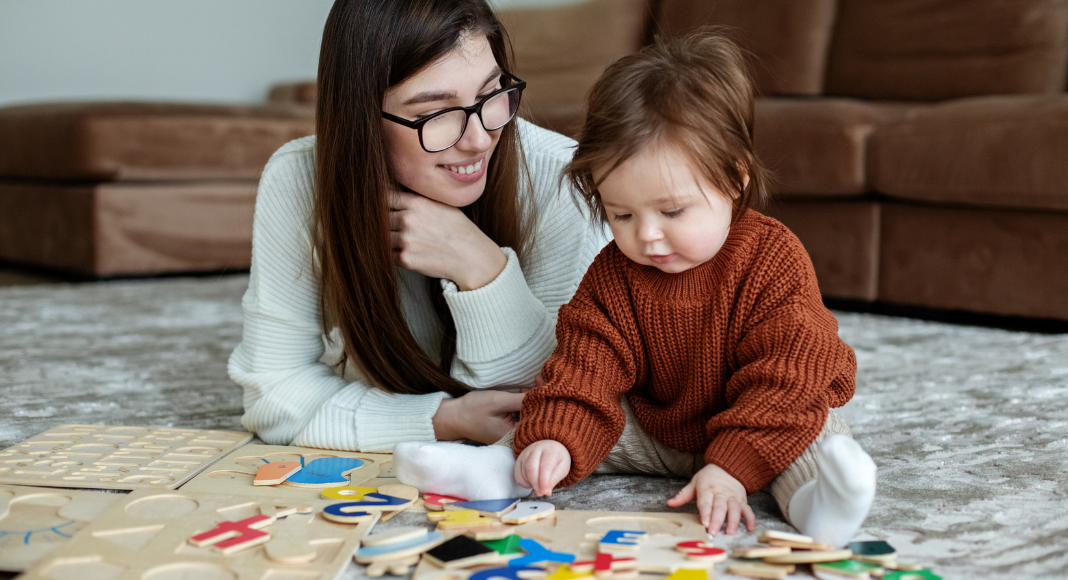 Mom playing on the floor with child