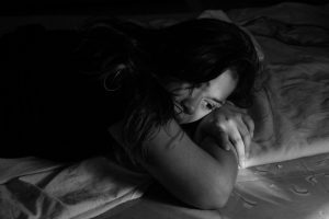 Image shows a woman alone