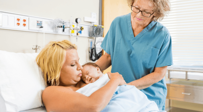 postpartum mom with nurse