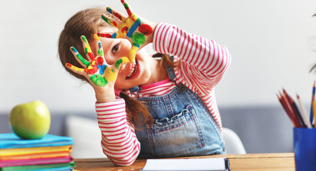 Kid with finger paint. keeping childhood memories organized 